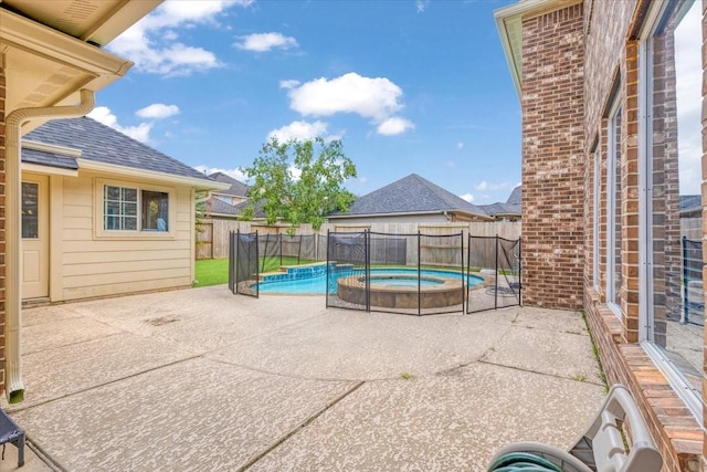 5822 Bailey Springs Ct, Katy, TX 77450 - view of swimming pool featuring a patio, a fenced backyard, and a pool with connected hot tub