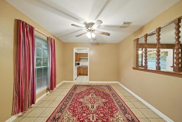 9506 Kell Cir, Houston, TX 77040 - spare room with light tile patterned floors, plenty of natural light, and a ceiling fan
