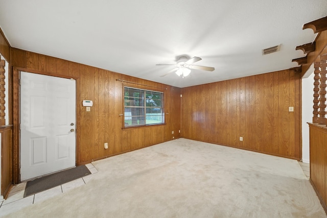 9506 Kell Cir, Houston, TX 77040 - foyer entrance with ceiling fan, wood walls, and light carpet