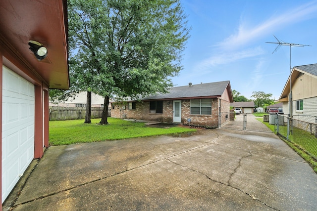 9506 Kell Cir, Houston, TX 77040 - view of front facade featuring a gate, concrete driveway, brick siding, and a garage