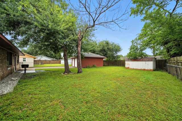 9506 Kell Cir, Houston, TX 77040 - fenced backyard featuring a shed, a patio, and a garage
