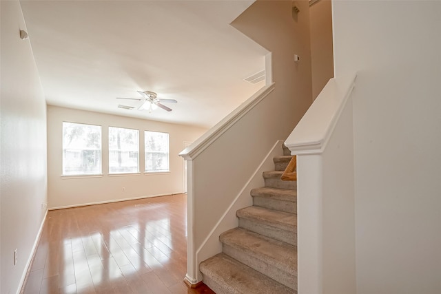 14 Scenic Brook Ct, The Woodlands, TX 77382 - stairway with a ceiling fan and wood finished floors