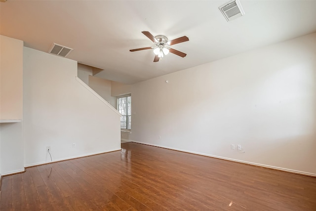 14 Scenic Brook Ct, The Woodlands, TX 77382 - empty room featuring a ceiling fan, wood finished floors, and stairs