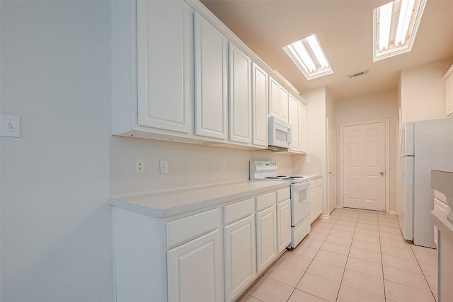 14 Scenic Brook Ct, The Woodlands, TX 77382 - kitchen with white appliances, light tile patterned floors, white cabinetry, and light countertops