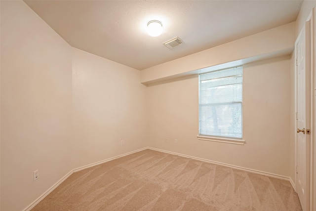 14 Scenic Brook Ct, The Woodlands, TX 77382 - unfurnished room featuring baseboards and light carpet