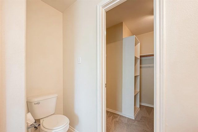 14 Scenic Brook Ct, The Woodlands, TX 77382 - bathroom with baseboards and toilet