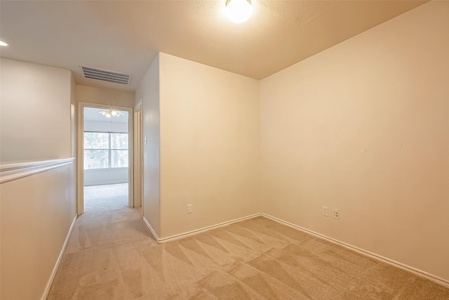 14 Scenic Brook Ct, The Woodlands, TX 77382 - spare room featuring light carpet and baseboards