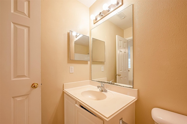 14 Scenic Brook Ct, The Woodlands, TX 77382 - half bath featuring vanity and toilet