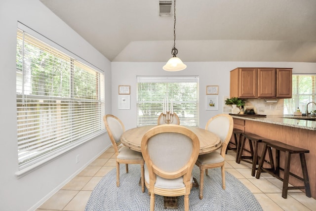70 N Lace Arbor Dr, The Woodlands, TX 77382 - dining room featuring lofted ceiling and light tile patterned floors