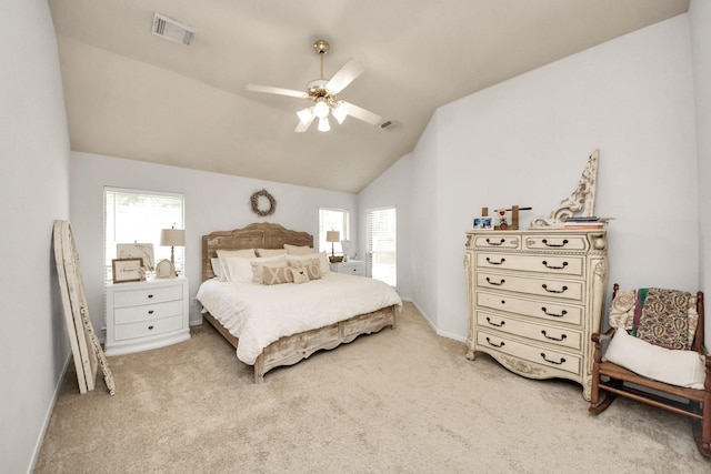 70 N Lace Arbor Dr, The Woodlands, TX 77382 - bedroom with lofted ceiling, light carpet, and a ceiling fan