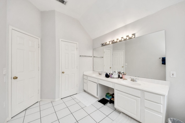 70 N Lace Arbor Dr, The Woodlands, TX 77382 - bathroom featuring double vanity, lofted ceiling, and tile patterned flooring