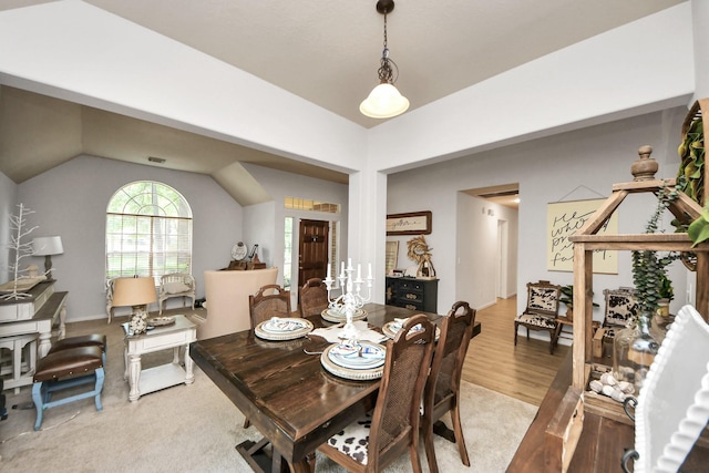 70 N Lace Arbor Dr, The Woodlands, TX 77382 - dining area with lofted ceiling and light wood-style floors