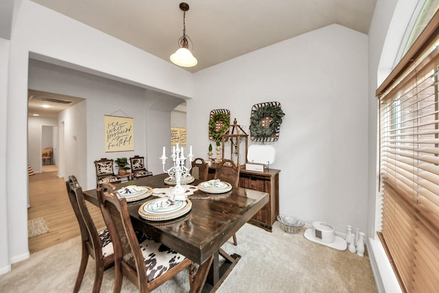 70 N Lace Arbor Dr, The Woodlands, TX 77382 - dining area with light colored carpet and lofted ceiling