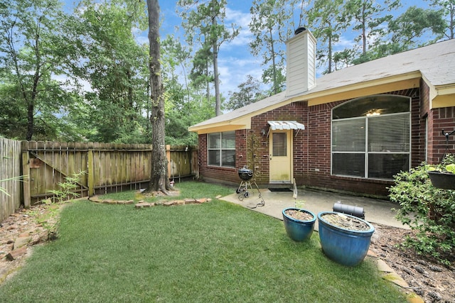 70 N Lace Arbor Dr, The Woodlands, TX 77382 - fenced backyard featuring a patio