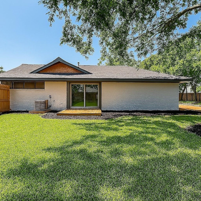 7810 Nairn St, Houston, TX 77074 - back of house featuring brick siding and roof with shingles