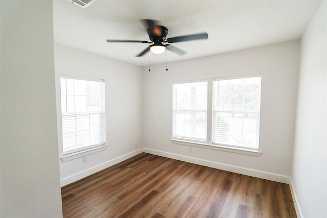 2120 Yates St, Houston, TX 77020 - empty room featuring healthy amount of natural light, dark wood-style floors, and ceiling fan