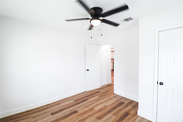 2120 Yates St, Houston, TX 77020 - unfurnished bedroom featuring light wood-type flooring and ceiling fan