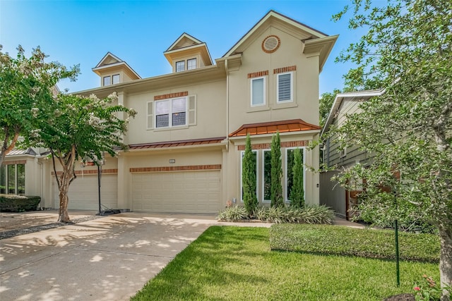 4006 Lanark Ln, Houston, TX 77025 - townhome / multi-family property featuring a standing seam roof, stucco siding, an attached garage, driveway, and a metal roof