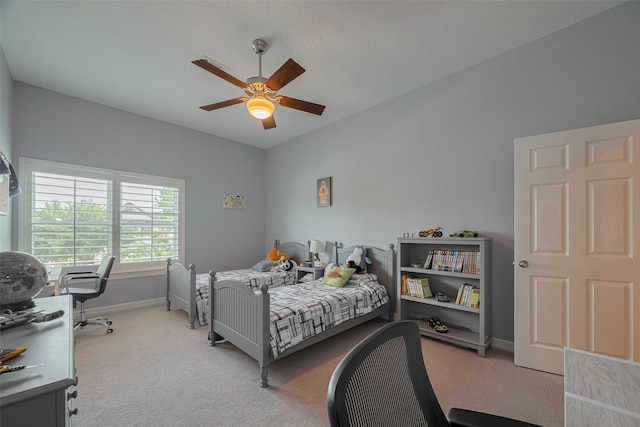 4006 Lanark Ln, Houston, TX 77025 - carpeted bedroom featuring baseboards and ceiling fan