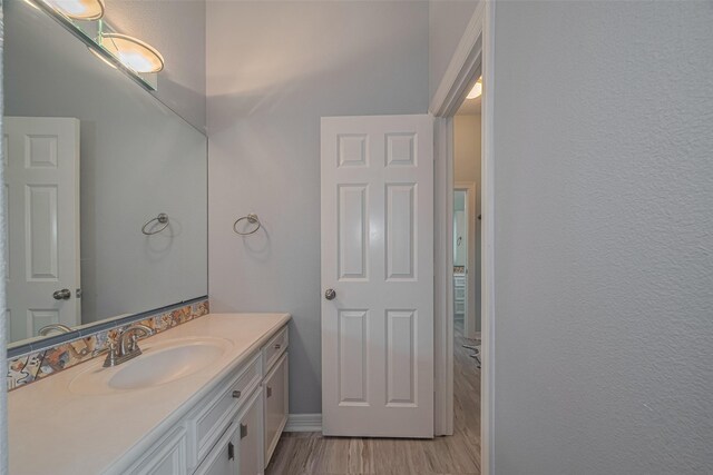 4006 Lanark Ln, Houston, TX 77025 - bathroom featuring vanity and wood finished floors