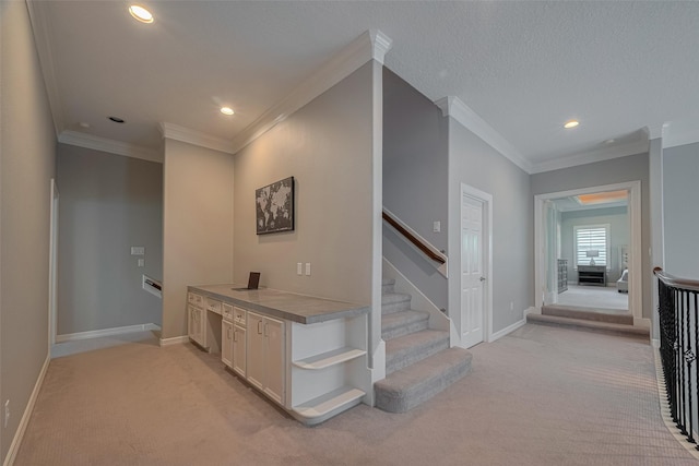4006 Lanark Ln, Houston, TX 77025 - hall with light colored carpet, crown molding, recessed lighting, and stairs