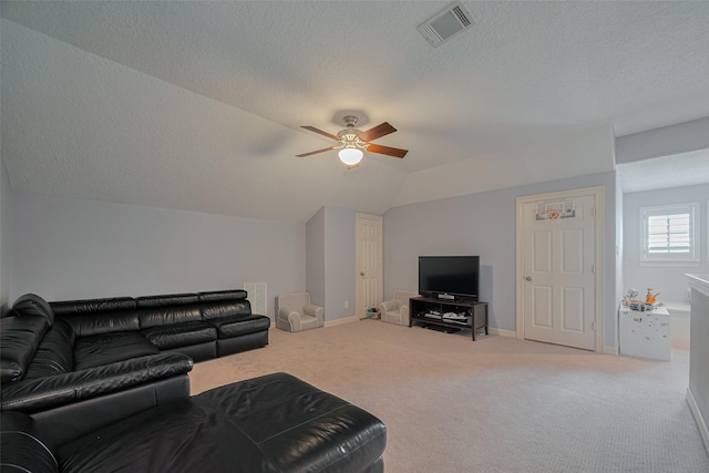4006 Lanark Ln, Houston, TX 77025 - living room with a ceiling fan, carpet floors, vaulted ceiling, and a textured ceiling