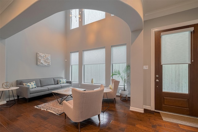4006 Lanark Ln, Houston, TX 77025 - living area with crown molding, hardwood / wood-style flooring, arched walkways, and a chandelier