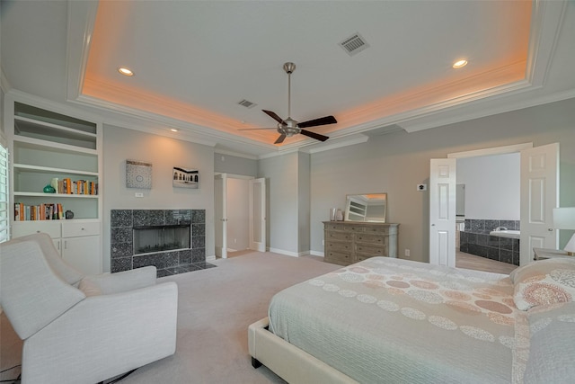 4006 Lanark Ln, Houston, TX 77025 - bedroom with a tray ceiling, ornamental molding, recessed lighting, a fireplace, and carpet flooring