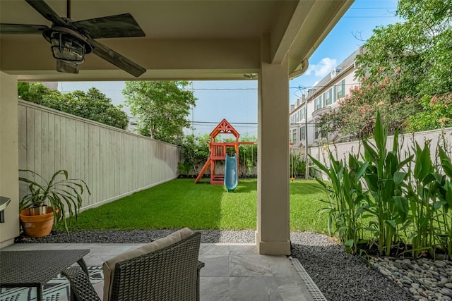 4006 Lanark Ln, Houston, TX 77025 - fenced backyard with a playground, a ceiling fan, and a patio area