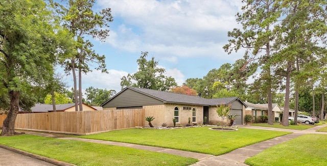 2807 Canary Ln, Humble, TX 77396 - view of front of property with brick siding, driveway, and a garage