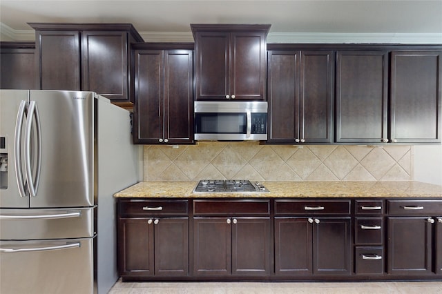17315 Cumberland Park Ln, Humble, TX 77346 - kitchen featuring stainless steel appliances, light stone countertops, tasteful backsplash, and crown molding