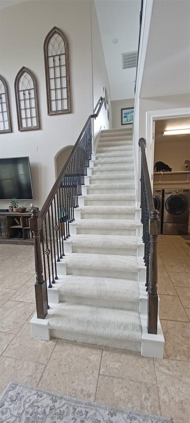 17315 Cumberland Park Ln, Humble, TX 77346 - staircase featuring washer and dryer and stone tile floors