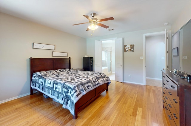 17315 Cumberland Park Ln, Humble, TX 77346 - bedroom featuring light wood-style floors, ceiling fan, and ensuite bath