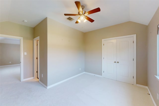 17315 Cumberland Park Ln, Humble, TX 77346 - unfurnished bedroom with lofted ceiling, light carpet, a closet, and ceiling fan