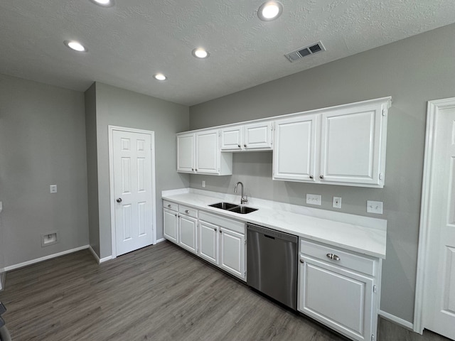 4607 Blue Rose Cir, Missouri City, TX 77459 - kitchen with dishwasher, white cabinetry, dark wood-type flooring, light countertops, and recessed lighting