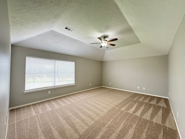 4607 Blue Rose Cir, Missouri City, TX 77459 - empty room featuring carpet floors, a ceiling fan, a textured ceiling, and lofted ceiling