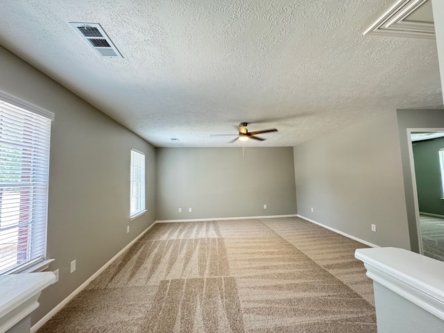 4607 Blue Rose Cir, Missouri City, TX 77459 - carpeted empty room with ceiling fan and a textured ceiling
