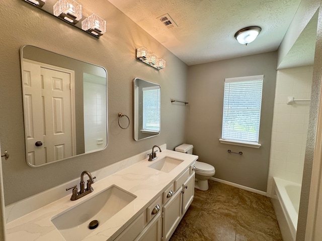 4607 Blue Rose Cir, Missouri City, TX 77459 - full bath with double vanity, a textured ceiling, and shower / tub combination