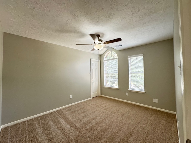 4607 Blue Rose Cir, Missouri City, TX 77459 - carpeted spare room featuring a ceiling fan and a textured ceiling