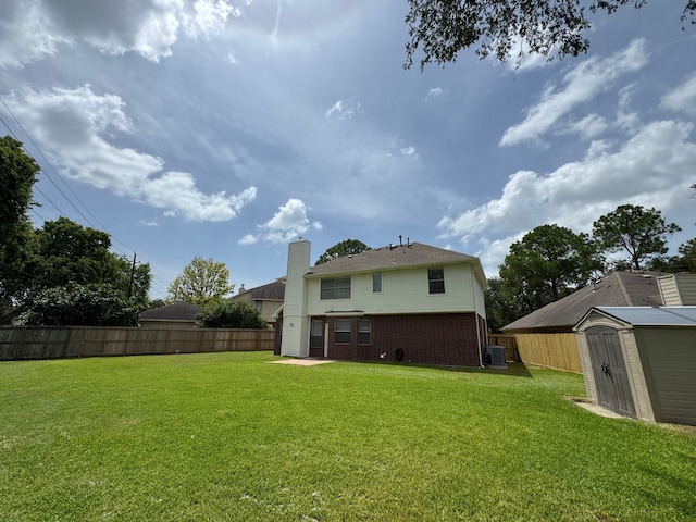 4607 Blue Rose Cir, Missouri City, TX 77459 - rear view of house with a shed, brick siding, and a chimney