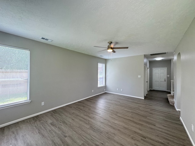 4607 Blue Rose Cir, Missouri City, TX 77459 - unfurnished room featuring a textured ceiling, dark wood-type flooring, and ceiling fan