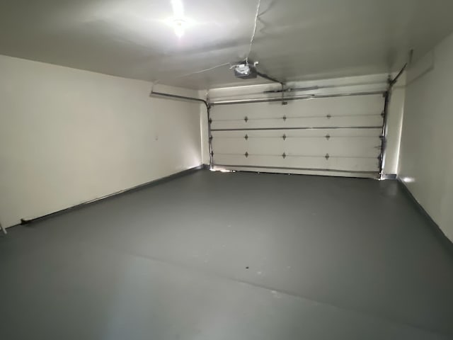 7726 Ashmole Ln, Houston, TX 77088 - garage featuring a garage door opener
