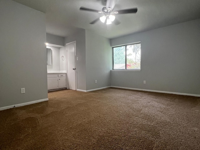 7726 Ashmole Ln, Houston, TX 77088 - unfurnished bedroom with carpet floors, ensuite bath, and a ceiling fan