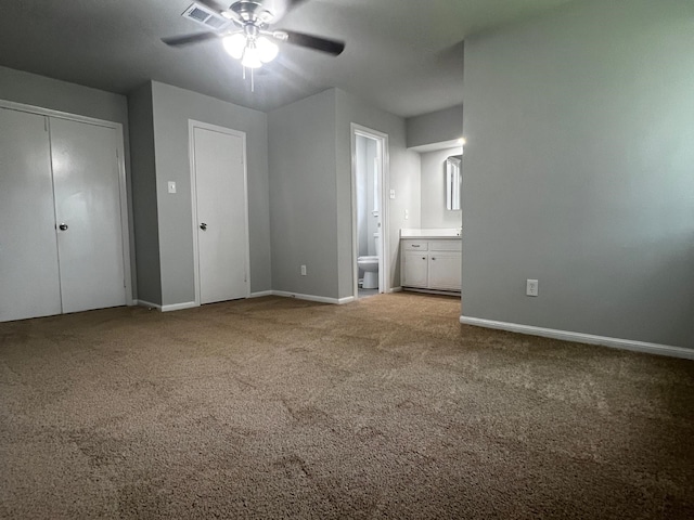 7726 Ashmole Ln, Houston, TX 77088 - unfurnished bedroom with carpet, ensuite bath, and ceiling fan
