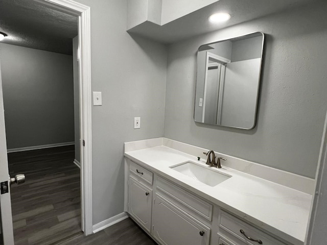 7726 Ashmole Ln, Houston, TX 77088 - bathroom featuring vanity and wood finished floors