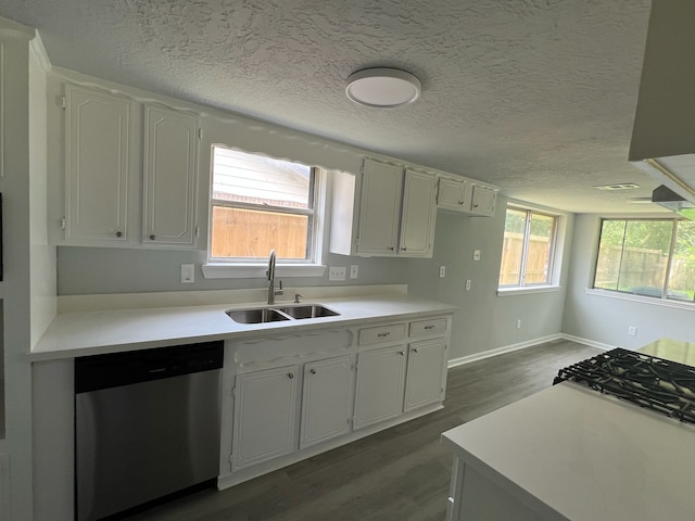 7726 Ashmole Ln, Houston, TX 77088 - kitchen with dishwasher, dark wood-style flooring, white cabinetry, light countertops, and a textured ceiling