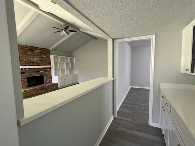 7726 Ashmole Ln, Houston, TX 77088 - hall with a textured ceiling, dark wood finished floors, and vaulted ceiling
