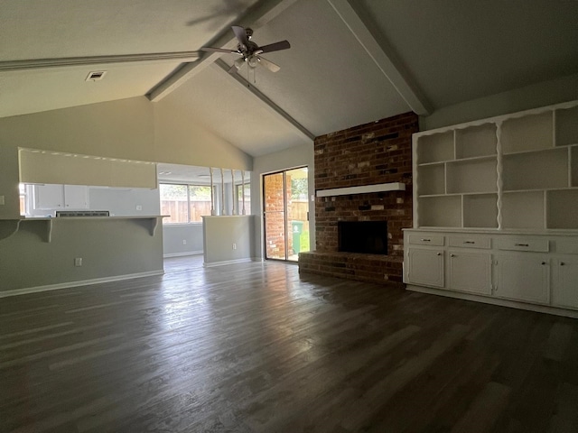 7726 Ashmole Ln, Houston, TX 77088 - unfurnished living room featuring a ceiling fan, dark wood-type flooring, and a fireplace