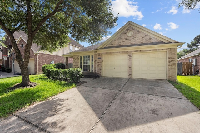 11047 Pierce Valley Dr, Richmond, TX 77406 - ranch-style house featuring brick siding, a garage, and driveway