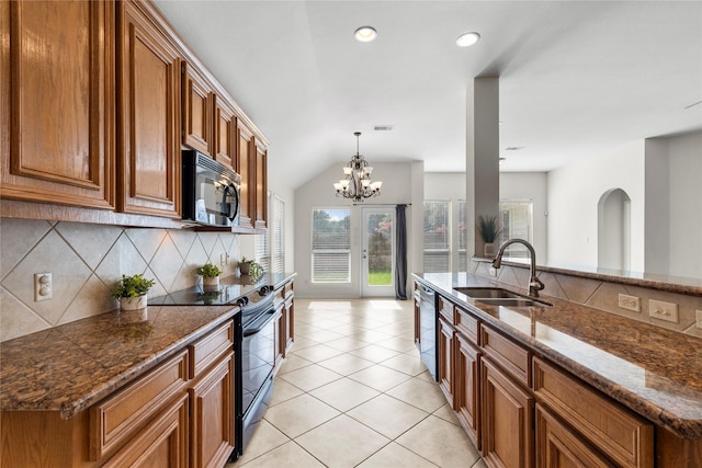 11047 Pierce Valley Dr, Richmond, TX 77406 - kitchen with black appliances, brown cabinets, tasteful backsplash, light tile patterned floors, and recessed lighting
